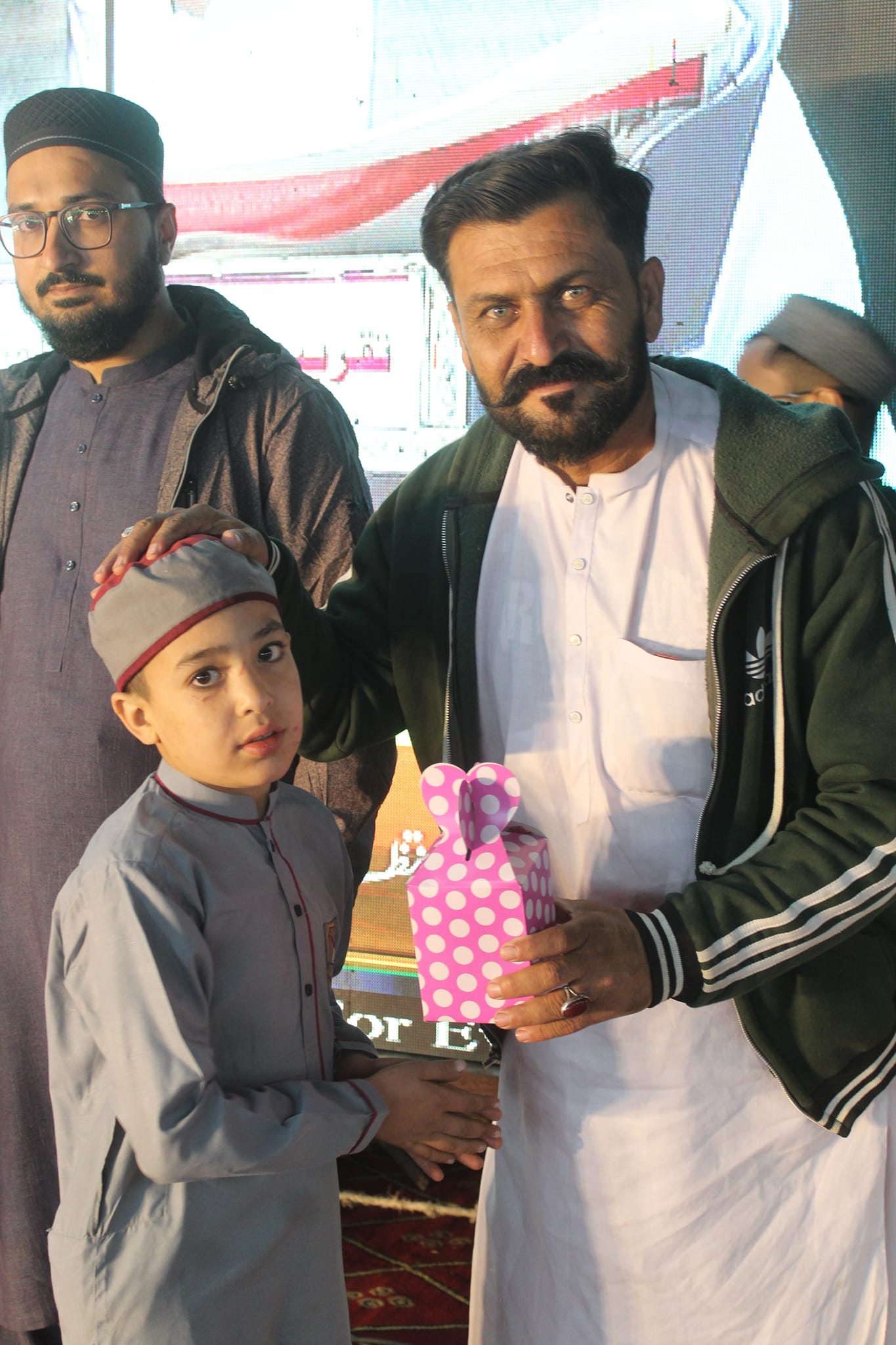 Person sitting in a modern building with a scenic view